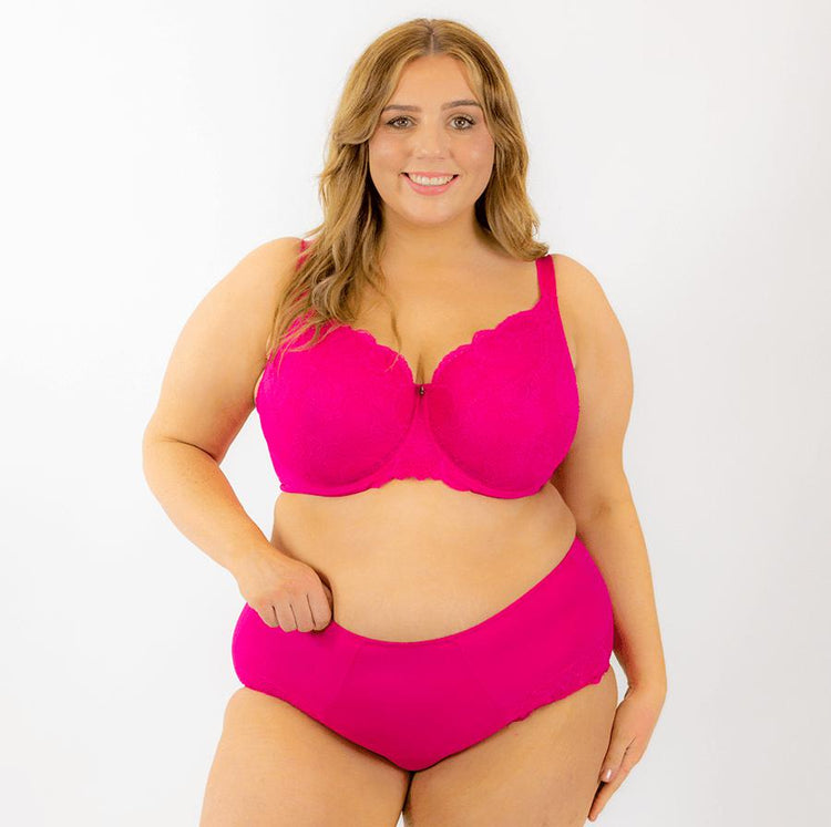 Premium Photo  Lacy bra on pink background